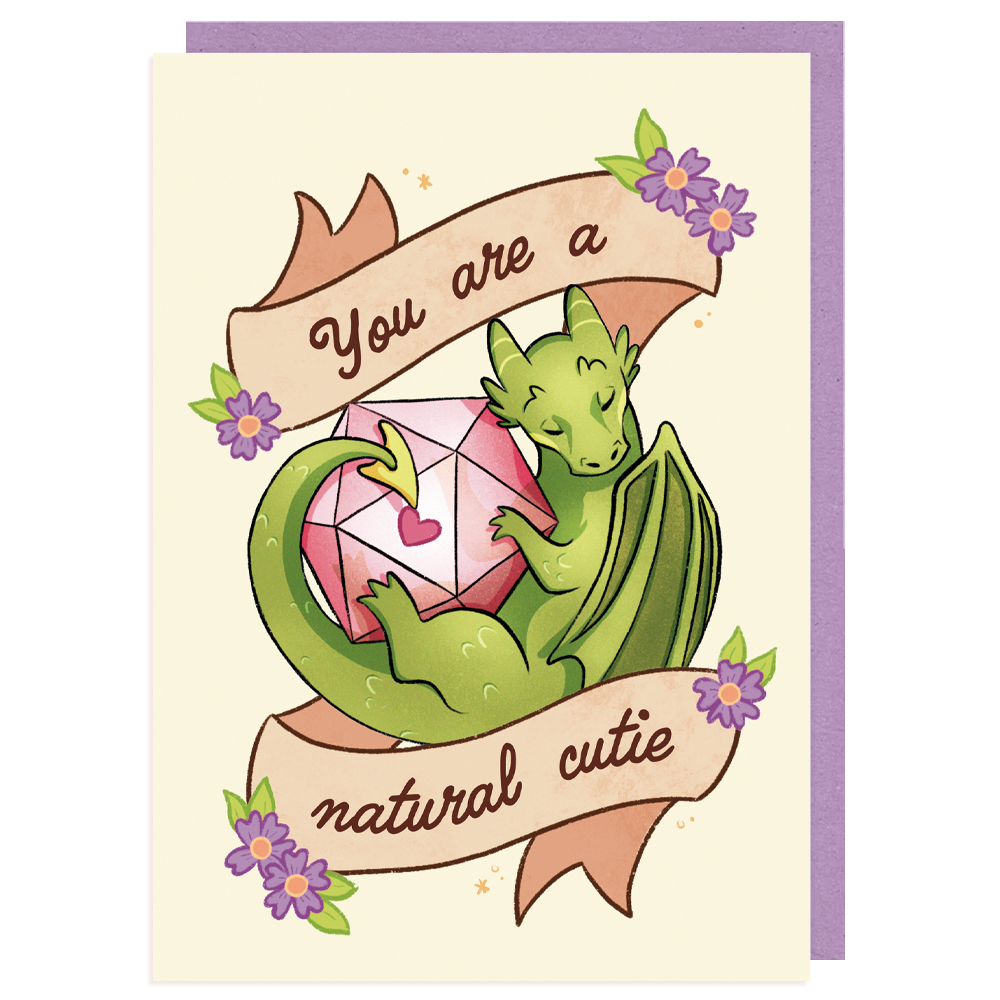 A product mockup of a D&D themed postcard. It pictures a dragon with a D20 dice and text saying ''you are a natural cutie''